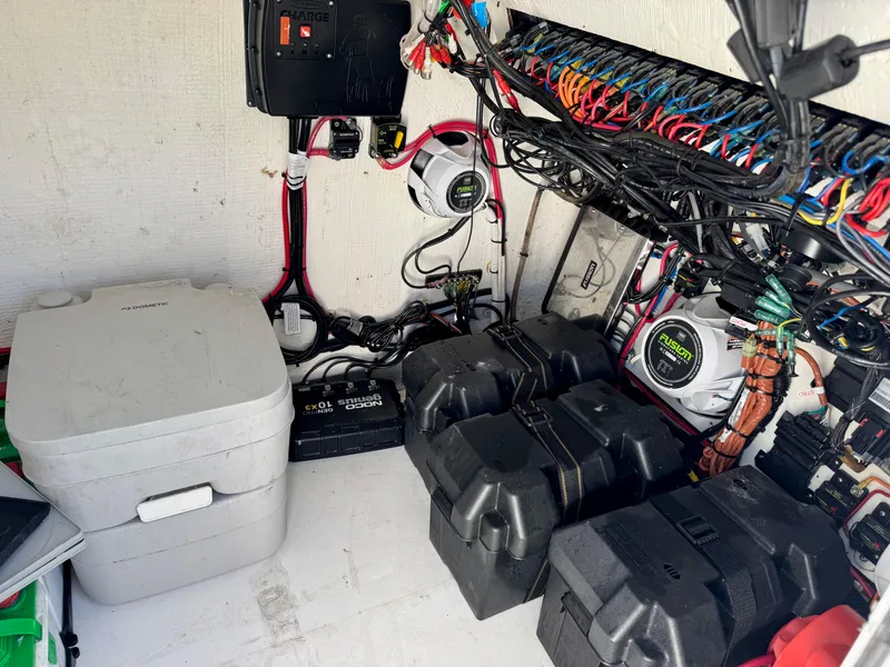 Slide: The Image of Electrical system and storage area of 2023 Twin Vee 280 GFX CC boat. - 32