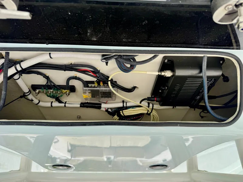 Slide: The Image of 2023 Twin Vee 280 GFX CC boat wiring and electronics compartment. - 34