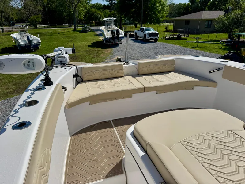 Slide: The Image of 2023 Twin Vee 280 GFX CC boat with beige seating and modern design. - 41