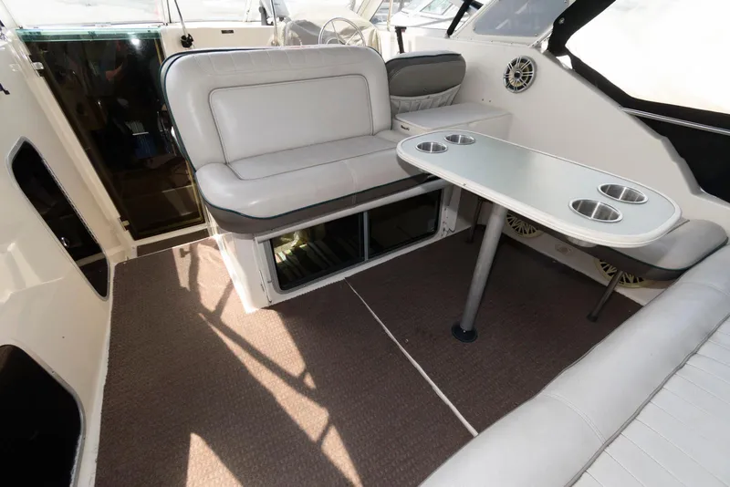 Slide: The Image of Interior of 1996 Maxum 2700 SCR boat with seating and table. - 2