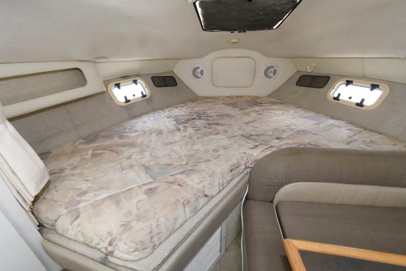 Slide: The Image of Interior cabin of 1996 Maxum 2700 SCR boat with spacious sleeping area. - 9