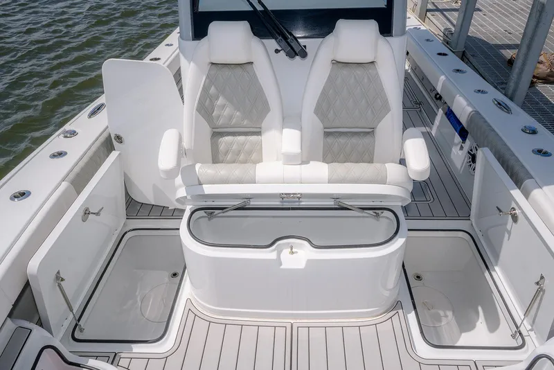Slide: The Image of 2024 Freeman 28 boat interior with dual seats, storage compartments, and sleek design. - 18
