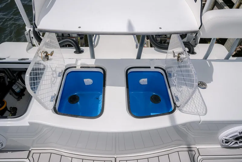 Slide: The Image of 2024 Freeman 28 boat with open dual livewells on deck. - 24