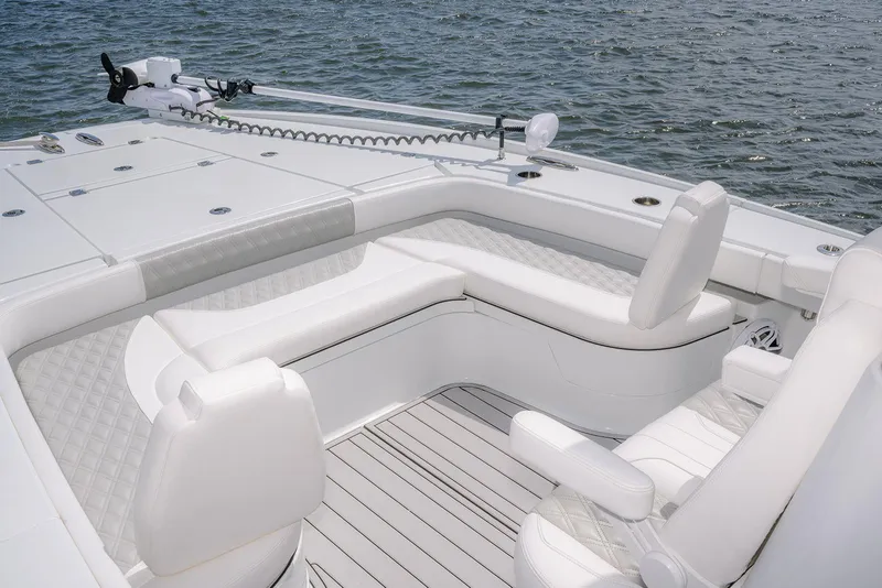Slide: The Image of Luxurious seating area on a 2024 Freeman 28 boat, overlooking calm waters. - 27