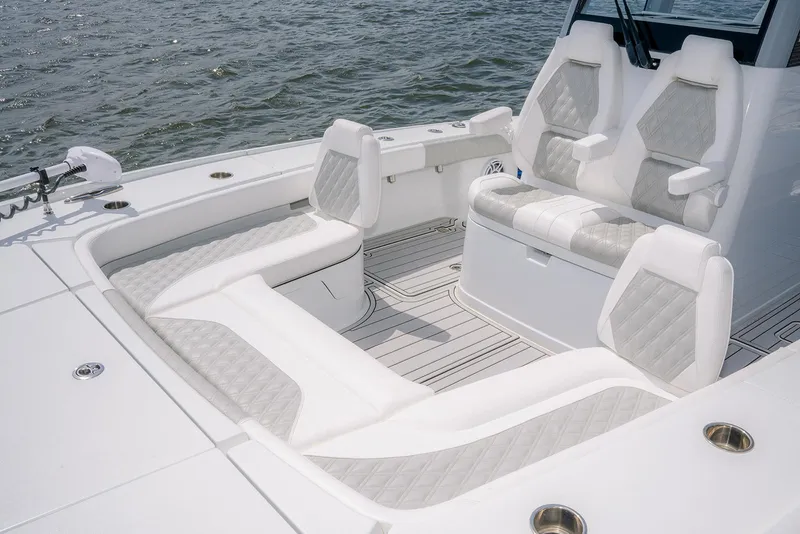 Slide: The Image of 2024 Freeman 28 boat interior with luxurious seating and modern design on open water. - 4