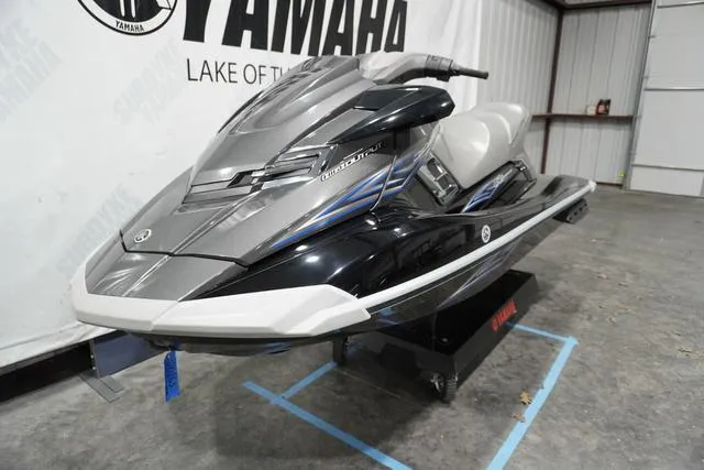 Slide: The Image of 2012 Yamaha WaveRunner FX jet ski in showroom, sleek design with black and silver accents. - 2