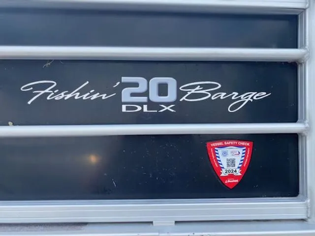 Slide: The Image of 2018 Sun Tracker FISHIN' BARGE® 20 DLX with 2024 vessel safety check sticker. - 9