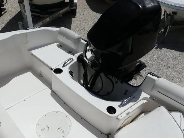 Slide: The Image of 2006 Boston Whaler 190 Outrage boat interior with motor and seating. - 9