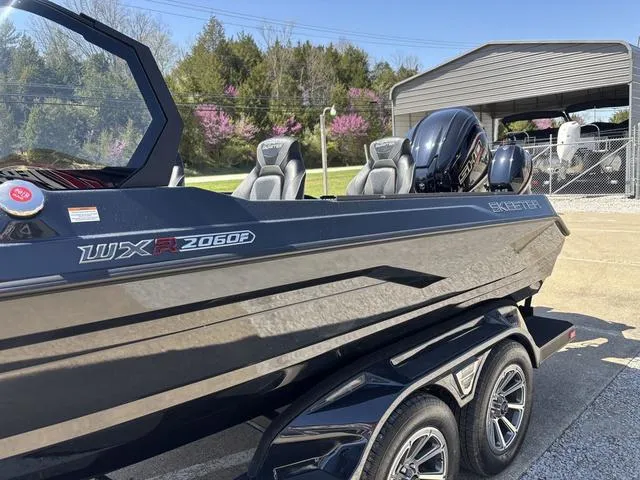 Slide: The Image of 2024 Skeeter WXR2060 F boat on trailer, sleek design, outdoor setting. - 10