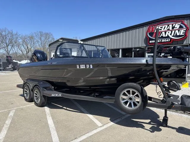 Slide: The Image of 2024 Skeeter WXR2060 F boat on trailer at Weda's Marine dealership. - 6