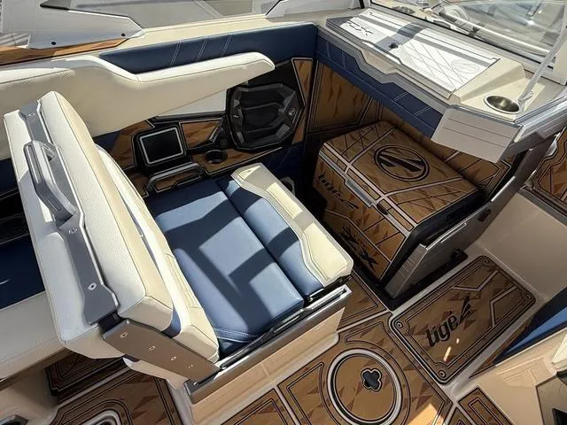 Slide: The Image of 2025 Tigé 23ZX boat interior with luxurious seating and modern design elements. - 13