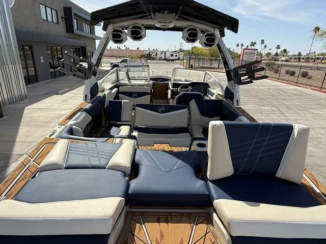 Slide: The Image of 2025 Tigé 23ZX boat interior with luxurious seating and advanced audio system. - 15