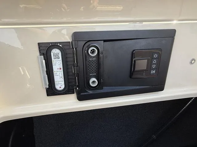 Slide: The Image of Control panel of a 2025 Tigé 23ZX boat, featuring digital and manual interfaces. - 20