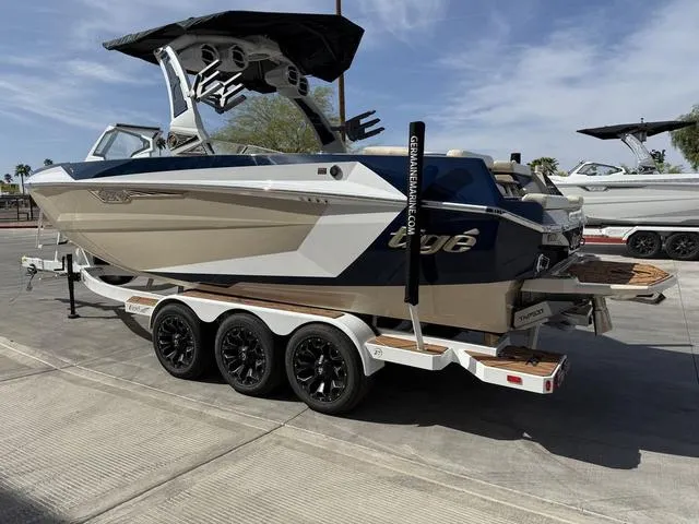 Slide: The Image of 2025 Tigé 23ZX boat on trailer, featuring sleek design and modern features. - 6