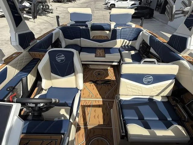 Slide: The Image of 2025 Tigé 23ZX boat interior with luxurious seating and modern design. - 9