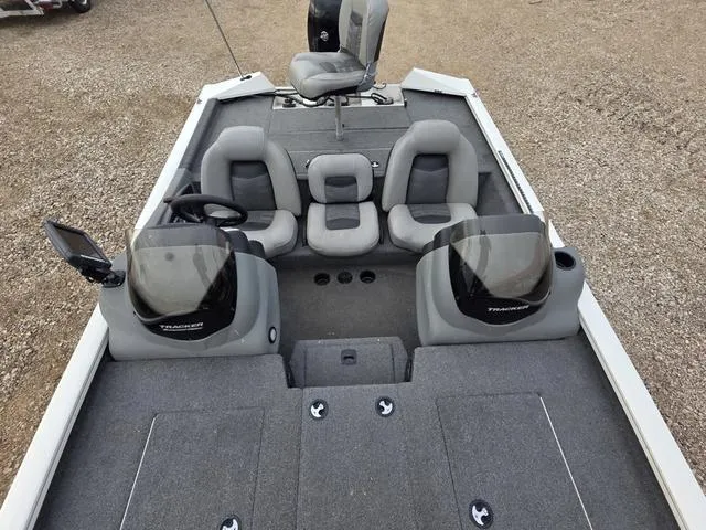 Slide: The Image of 2017 Tracker 195 boat interior with dual consoles and seating. - 11