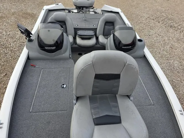 Slide: The Image of 2017 Tracker 195 boat interior with gray seating and carpeted deck. - 17