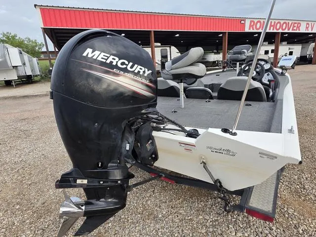 Slide: The Image of 2017 Tracker 195 boat with Mercury outboard motor at RV dealership. - 4