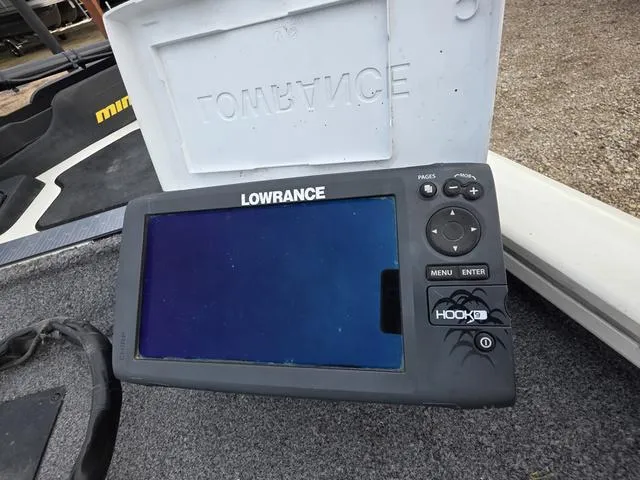 Slide: The Image of Lowrance Hook fish finder on 2017 Tracker 195 boat, showing control buttons and screen. - 5