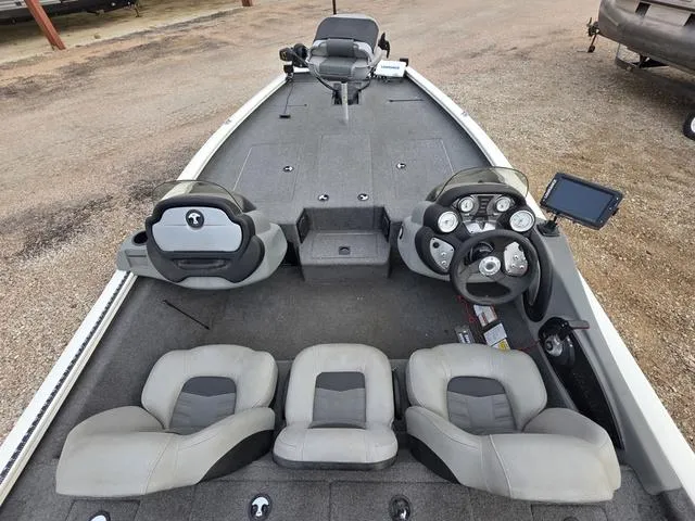 Slide: The Image of 2017 Tracker 195 boat interior with steering console and seating arrangement. - 8
