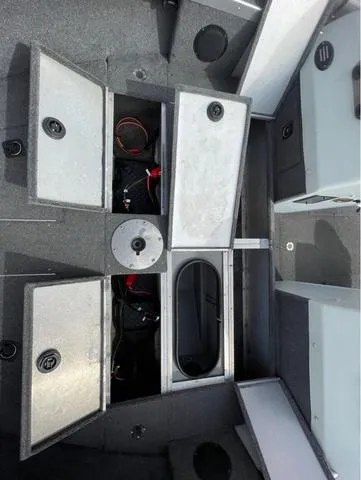 Slide: The Image of 1998 Alumacraft PRO 195 boat interior with open storage compartments. - 19