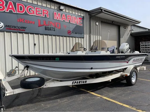 Slide: The Image of 1998 Alumacraft PRO 195 boat on trailer at Badger Marine dealership. - 2