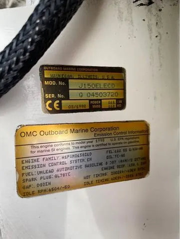 Slide: The Image of Close-up of OMC outboard engine labels on a 1998 Alumacraft PRO 195 boat. - 22