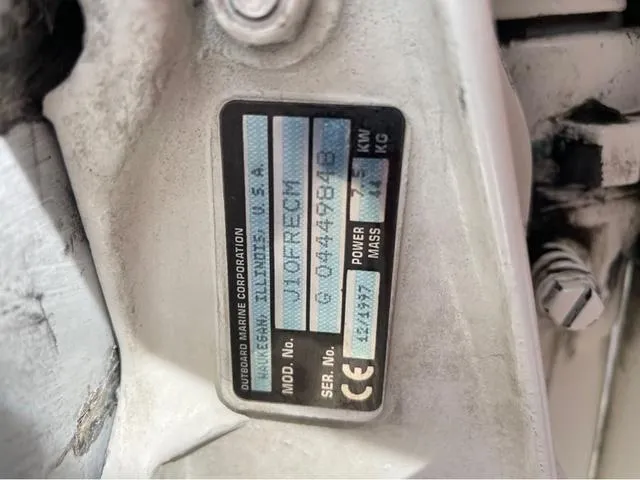 Slide: The Image of Close-up of an outboard motor serial plate on a 1998 Alumacraft PRO 195 boat. - 23