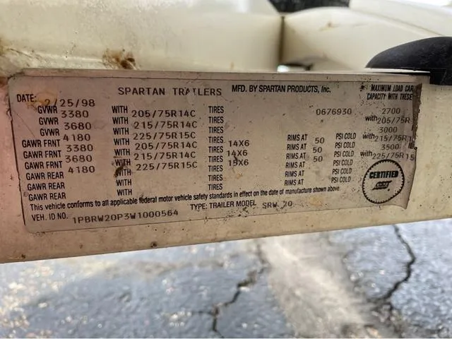 Slide: The Image of Label on Spartan Trailers, detailing tire specifications and load capacities, dated 1998. - 24