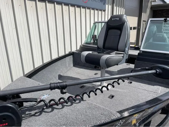 Slide: The Image of 2016 Lund 1650 Rebel XL Sport boat with a swivel seat and trolling motor. - 8