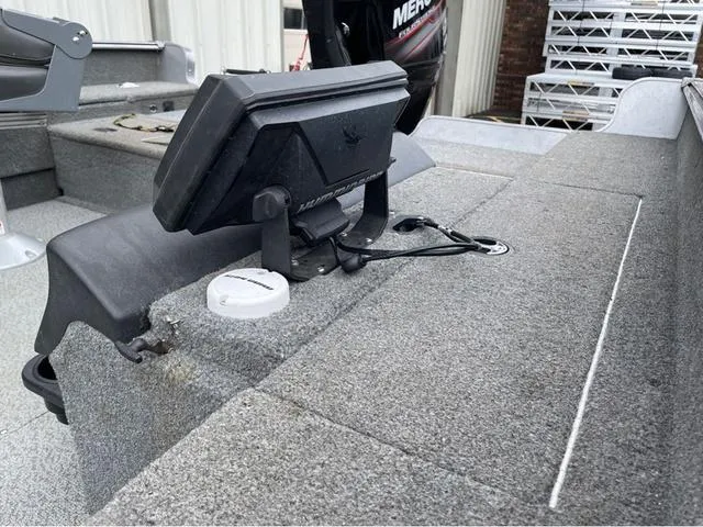 Slide: The Image of 2017 Lund 1675 Pro Guide boat with a swivel seat and trolling motor. - 12