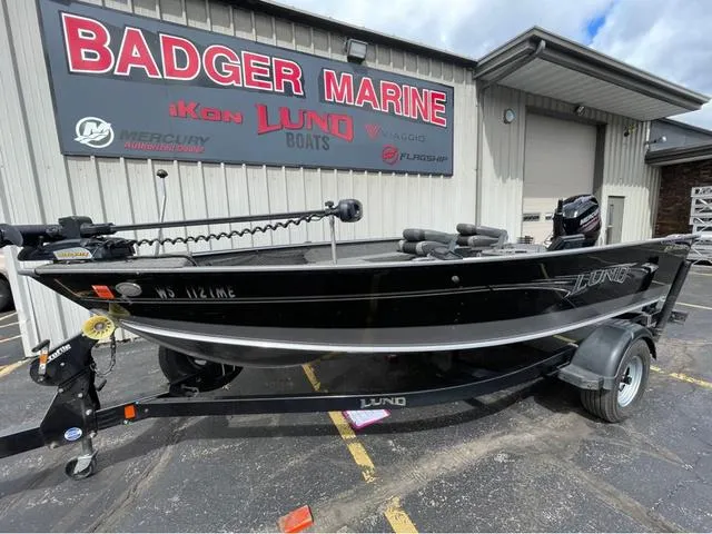 Slide: The Image of 2017 Lund 1675 Pro Guide boat interior with open storage compartments. - 22