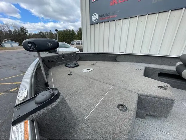 Slide: The Image of 2017 Lund 1675 Pro Guide boat with Mercury outboard motor in a parking lot. - 7