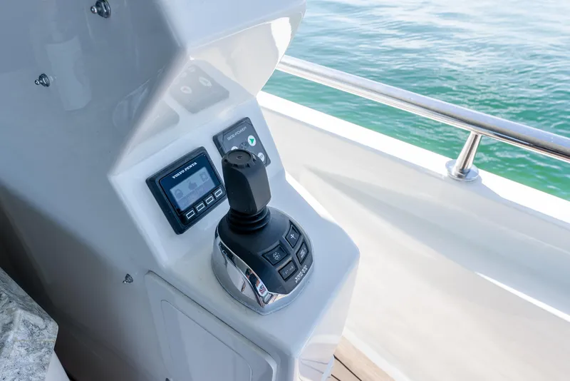 Slide: The Image of Control panel of 2021 Ocean Alexander 70E Motoryacht with joystick and display screens. - 20