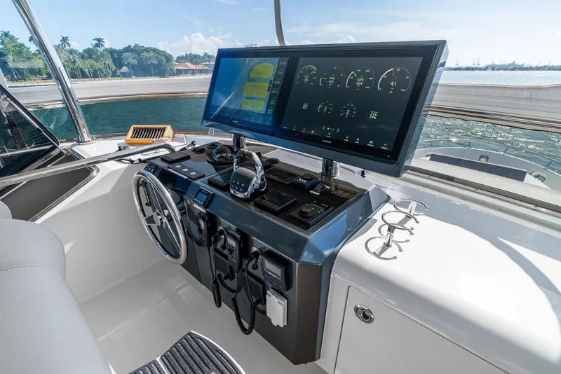 Slide: The Image of Helm of 2021 Ocean Alexander 70E Motoryacht with advanced navigation display and controls. - 29