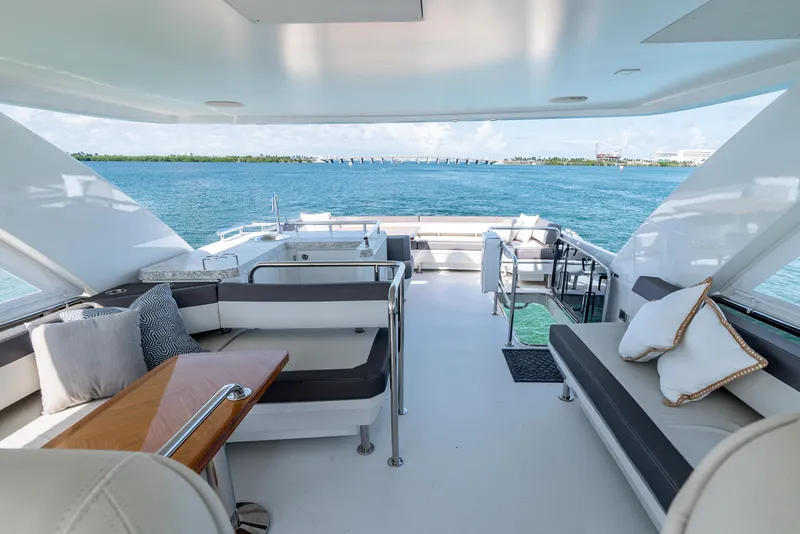 Slide: The Image of Luxurious 2021 Ocean Alexander 70E Motoryacht deck with elegant seating and ocean view. - 32