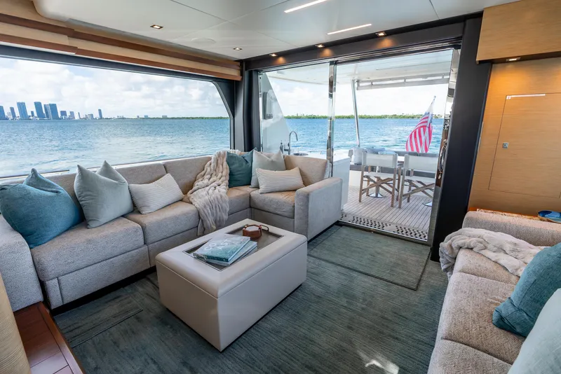 Slide: The Image of Luxurious interior of 2021 Ocean Alexander 70E Motoryacht with ocean view and plush seating. - 36