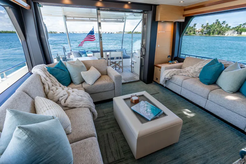 Slide: The Image of Luxurious interior of 2021 Ocean Alexander 70E Motoryacht with plush seating and ocean view. - 37