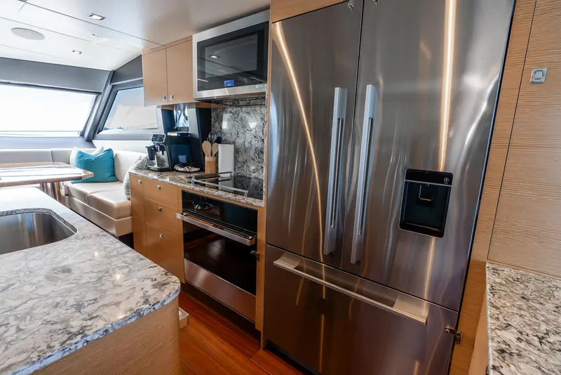 Slide: The Image of Luxurious kitchen interior of 2021 Ocean Alexander 70E Motoryacht with modern appliances. - 40