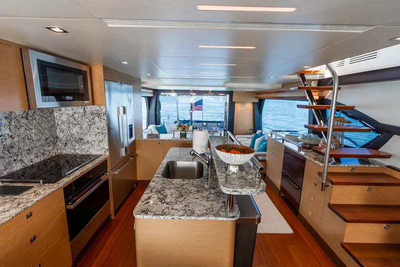 Slide: The Image of Luxurious interior of 2021 Ocean Alexander 70E Motoryacht with modern kitchen and ocean view. - 43