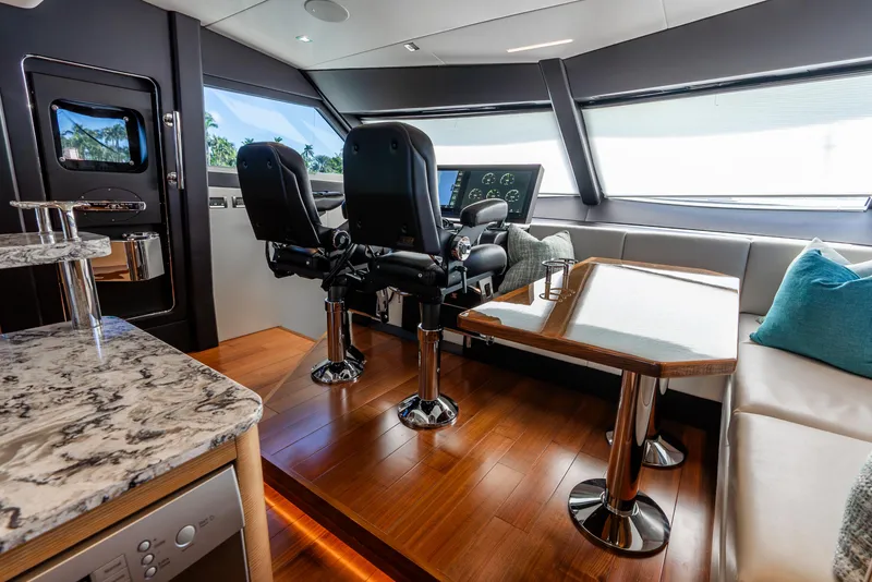 Slide: The Image of Luxurious interior of 2021 Ocean Alexander 70E Motoryacht with modern helm and seating area. - 45