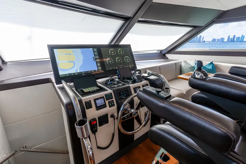 Slide: The Image of Cockpit of 2021 Ocean Alexander 70E Motoryacht with modern navigation equipment and leather seating. - 48