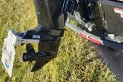 Slide: The Image of 2024 Tracker Super Guide V 16 SC boat motor on grass. - 2