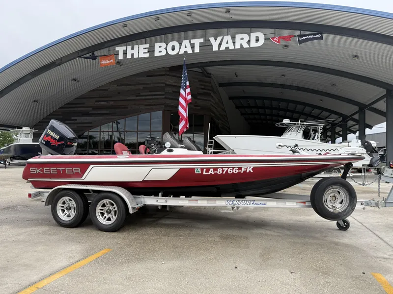 Slide: The Image of 2005 Skeeter SX 200 boat on trailer at The Boat Yard, featuring Yamaha engine. - 0