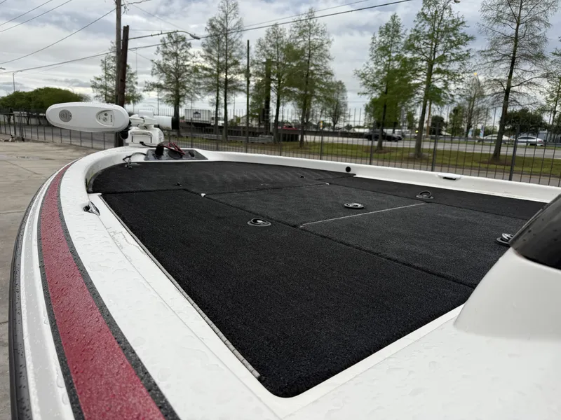Slide: The Image of 2005 Skeeter SX 200 boat deck with black carpet and red accents. - 12