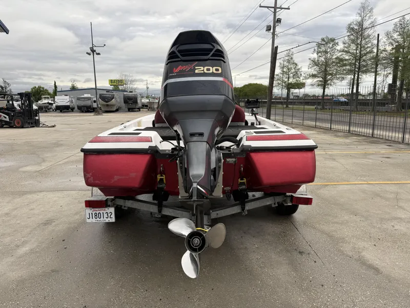 Slide: The Image of 2005 Skeeter SX 200 boat with Yamaha VMAX 200 engine, parked on a trailer. - 2