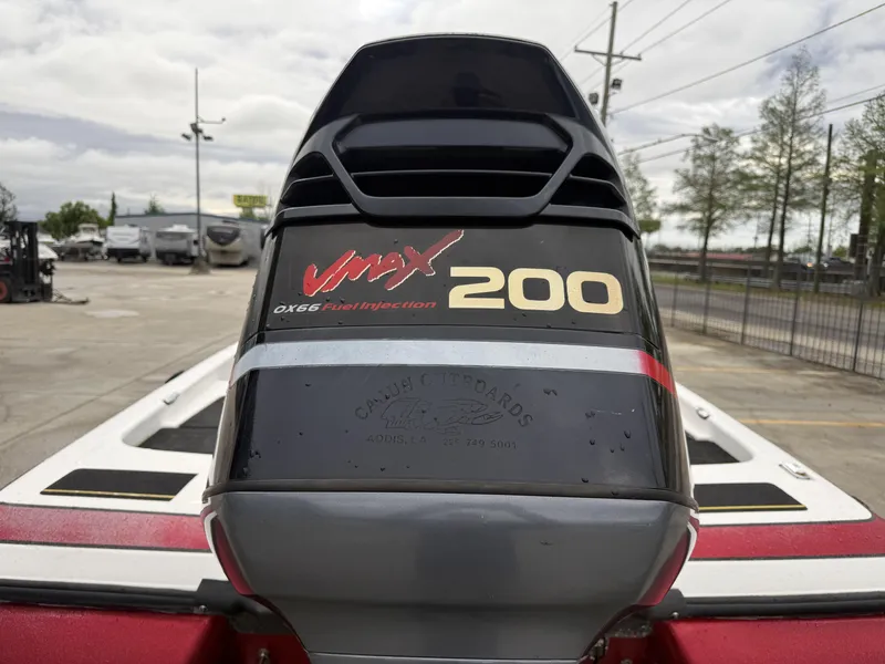 Slide: The Image of 2005 Skeeter SX 200 boat with VMAX 200 engine, parked outdoors. - 5