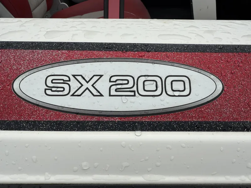 Slide: The Image of 2005 Skeeter SX 200 boat logo with raindrops on red and white surface. - 7