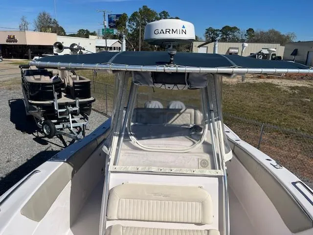 Slide: The Image of 2003 Grady-White 306 CC boat with Garmin radar, parked outdoors. - 11