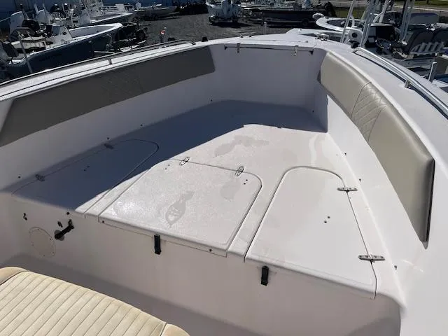 Slide: The Image of 2003 Grady-White 306 CC boat interior with seating and storage compartments. - 14